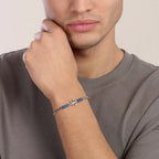 Bracciale Kidult uomo con pietre laviche blu e ancora centrale